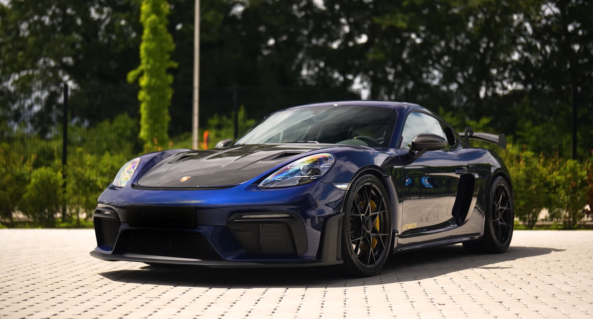 Blue sports car photographed after exterior detailing